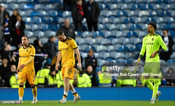 Livingston's Scott Pittman, Sean Kelly and Shamal George look dejected at full time during a Viaplay Cup Quarter-final match between Rangers and...
