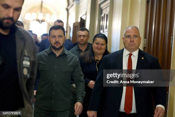 President of Ukraine Volodymyr Zelensky walks with Sergeant at Arms of the U.S. House of Representatives William McFarland as he leaves a meeting...