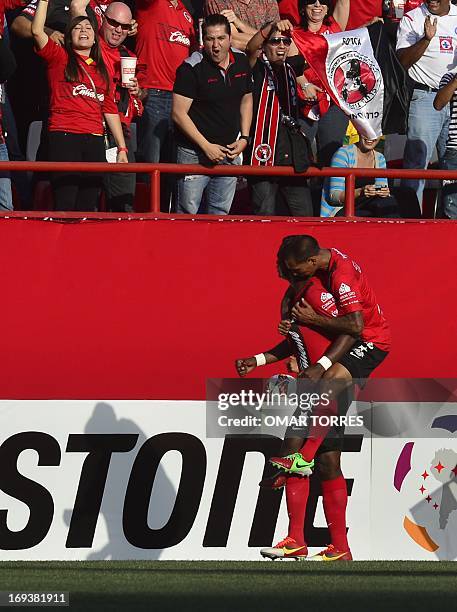 Duvier Riascos of Tijuana celebrates with teammate Edgar Castillo after scoring against Brazil's Atletico Mineiro during their Libertadores Cup...