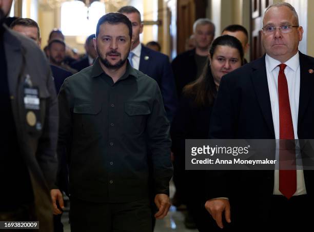 President of Ukraine Volodymyr Zelensky walks with Sergeant at Arms of the U.S. House of Representatives William McFarland as he leaves a meeting...
