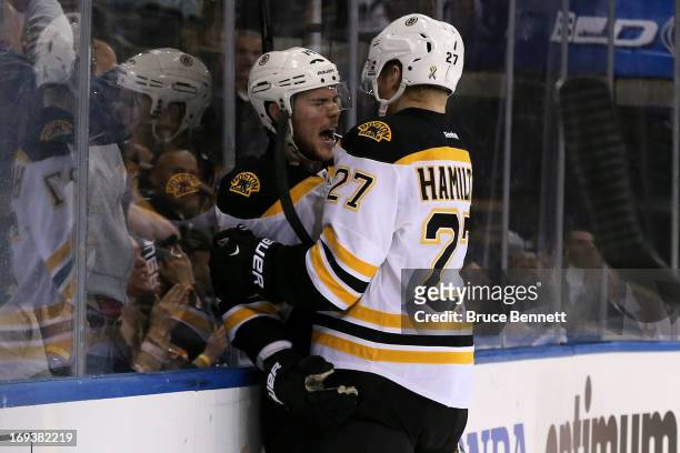 Tyler Seguin and Dougie Hamilton of the Boston Bruins celebrate after Seguin scored a goal in the third period against the New York Rangers in Game...