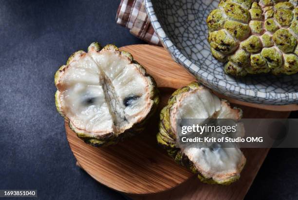 ripe annona squamosa on the table - sugar apple stock pictures, royalty-free photos & images