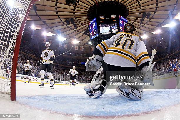 David Krejci, Zdeno Chara, Torey Krug and goalie Tuukka Rask of the Boston Bruins look on dejected as the New York Rangers celebrate their 4-3...