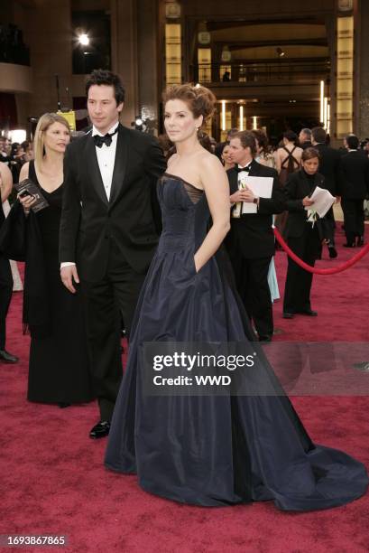 Keanu Reeves and Sandra Bullock attend the 78th Annual Academy Awards at the Kodak Theater. Bullock wears an Angel Sanchez gown.