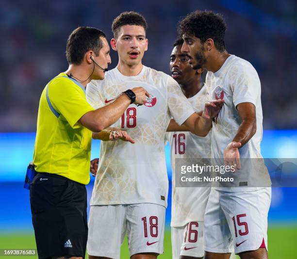 Uzbekistan referee Lutfullin Rustam gestures during the 19th Asian Games Hangzhou match between China and Qatar Huanglong Sports Centre Stadium in...