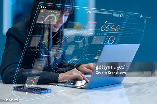 engineer programmer using laptop analyzing software coding and development at various information on futuristic virtual interface - interfaz de programación de aplicaciones fotografías e imágenes de stock