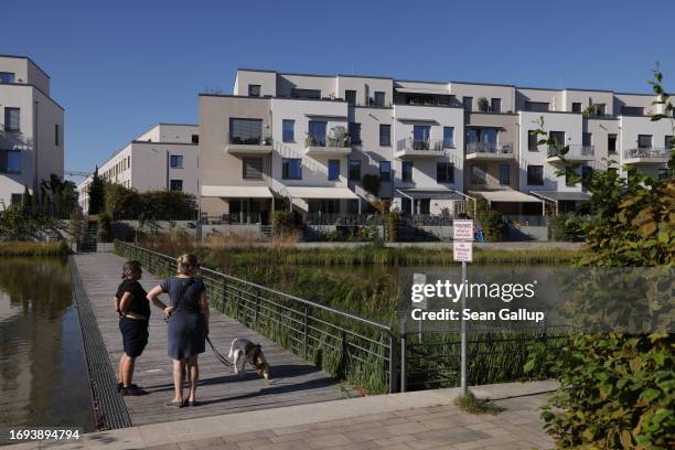 Women walk a dog at the newly-built 52 Nord residential apartment complex on September 21, 2023 in Berlin, Germany. 52 Nord, with a 6,000 square...