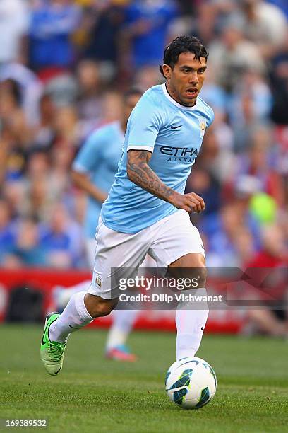 Carlos Tevez of Manchester City moves the ball up the pitch against the Chelsea during a friendly match at Busch Stadium on May 23, 2013 in St....