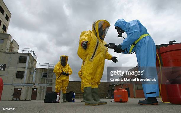 Members of the anti terrorism unit are tested for radiation and for plastic explosives during the New South Wales tactical operations unit mock...