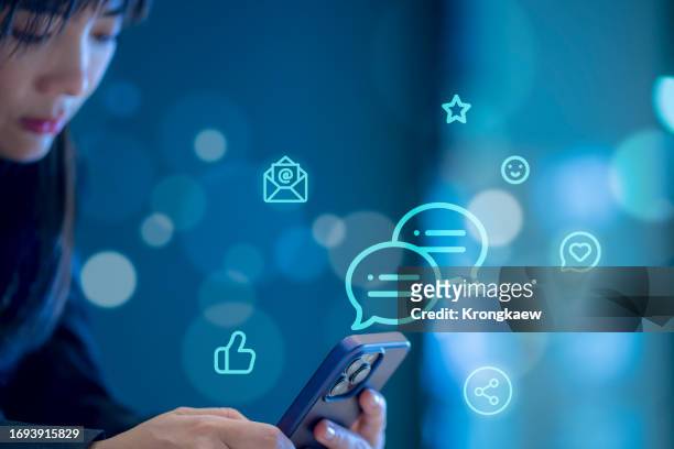 social media concept. young woman using mobile smart phone on social network connection - whatsapp stockfoto's en -beelden