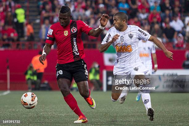 Duvier Riascos of Xolos fights for the ball with Júnior Machado of Atletico Mineiro during match between Xolos and Atletico Mineiro as part of the...