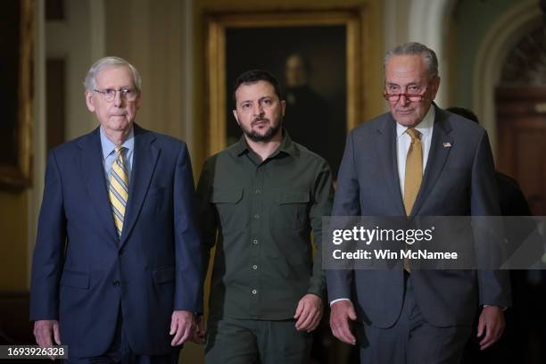 Senate Minority Leader Mitch McConnell and Senate Majority Leader Chuck Schumer walk with President of Ukraine Volodymyr Zelensky at the U.S. Capitol...