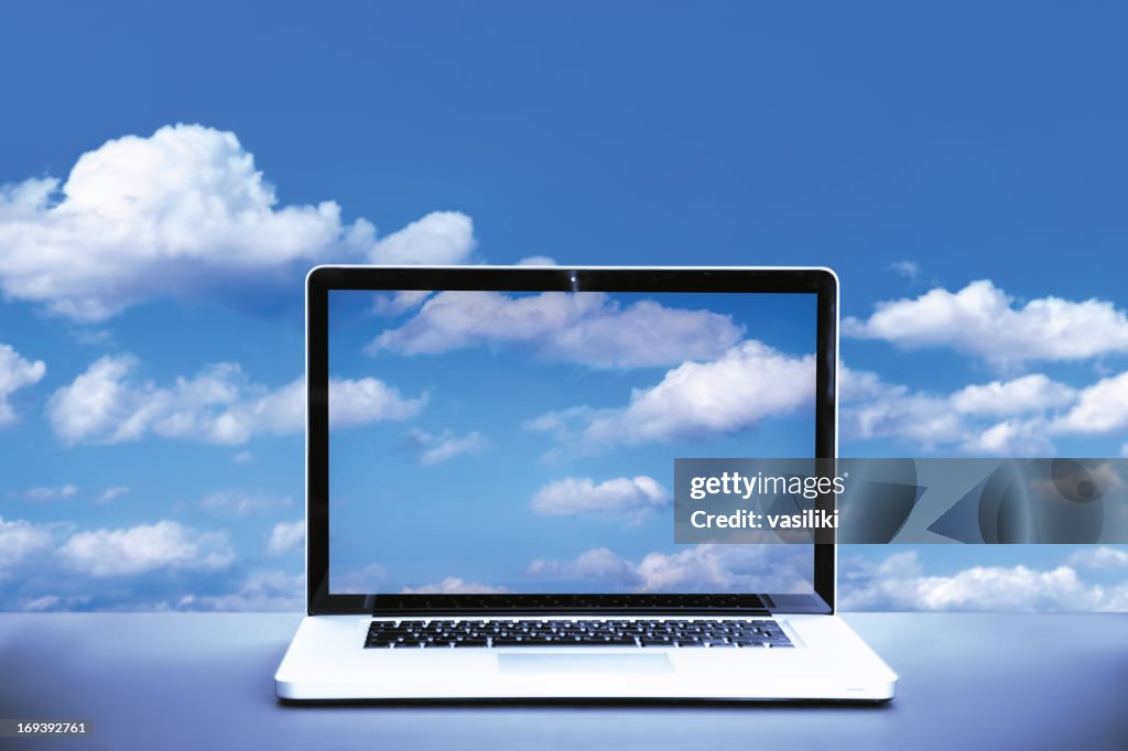 Laptop with with clouds on the screen