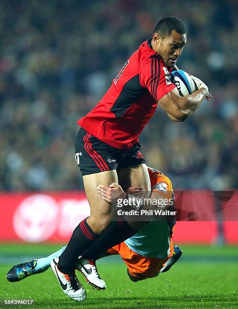 Robbie Fruean of the Crusaders is tackled during the round 15 Super Rugby match between the Chiefs and the Crusaders at Waikato Stadium on May 24,...