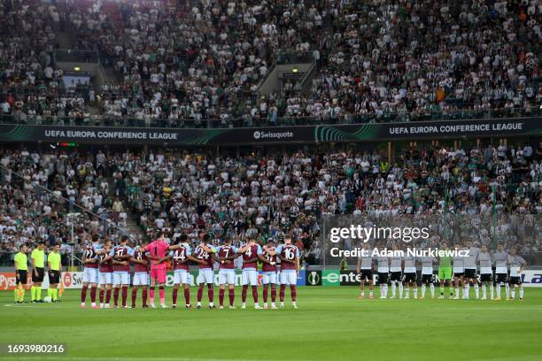 Players, fans and officials hold a minutes silence in memory of the victims of the earthquakes in Morocco and Libya prior to the UEFA Europa...