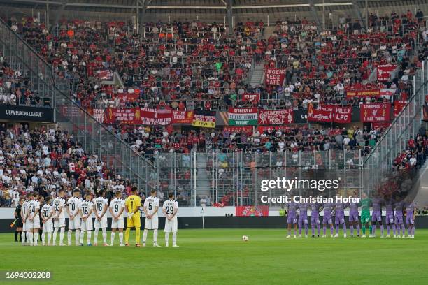 Players, fans and officials hold a minutes silence in memory of the victims of the earthquakes in Morocco and Libya prior to the UEFA Europa League...