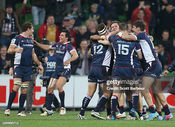 The Rebels celebrate at the final whistle after winning the round 15 Super Rugby match between the Rebels and the Waratahs at AAMI Park on May 24,...