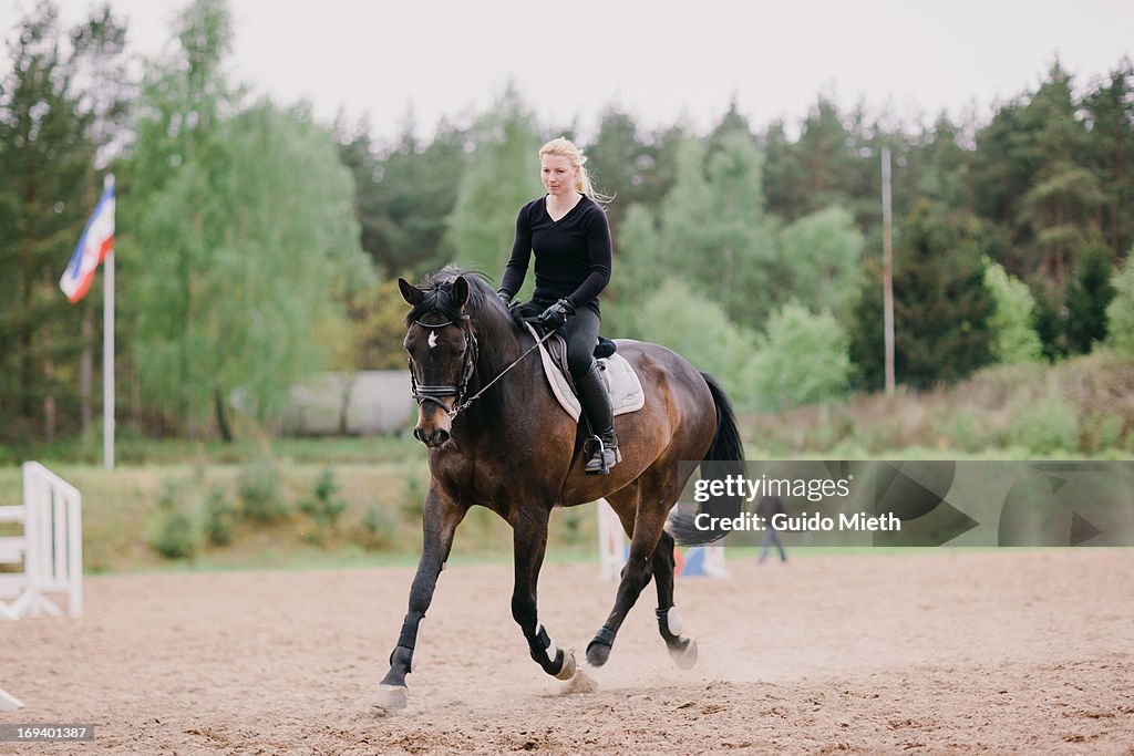 Woman and her horse doing dressage training