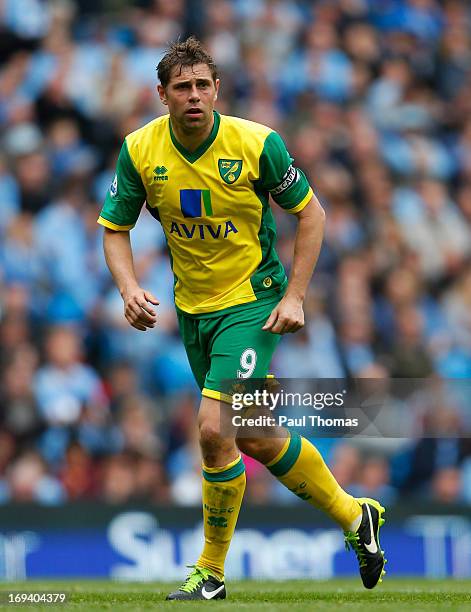 Grant Holt of Norwich in action during the Barclays Premier League match between Manchester City and Norwich City at the Etihad Stadium on May 19,...