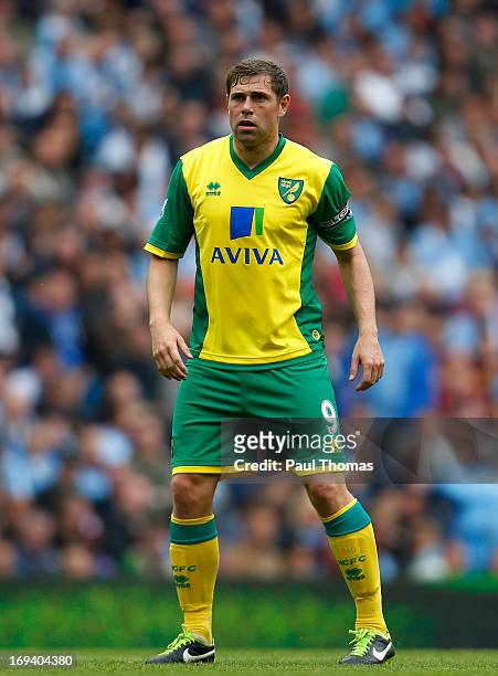 Grant Holt of Norwich watches on during the Barclays Premier League match between Manchester City and Norwich City at the Etihad Stadium on May 19,...