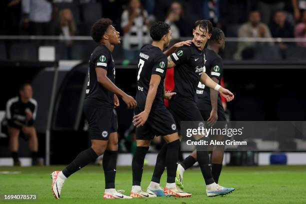 Robin Koch of Eintracht Frankfurt celebrates with teammates after scoring the team's second goal during the UEFA Europa Conference League match...