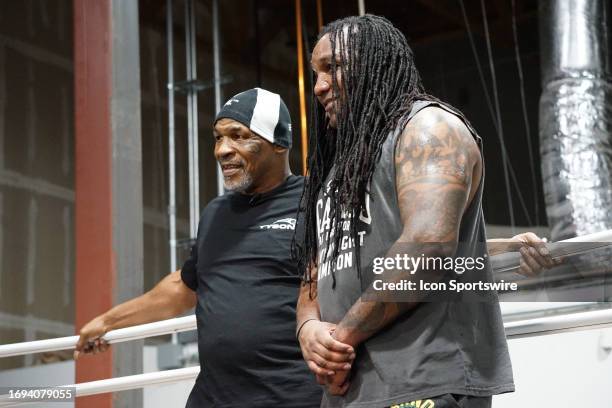 Mike Tyson and Dewey Cooper at the Tyson Fury vs. Francis Ngannou open workout on September 26 at Ngannou's private gym in Las Vegas, NV.