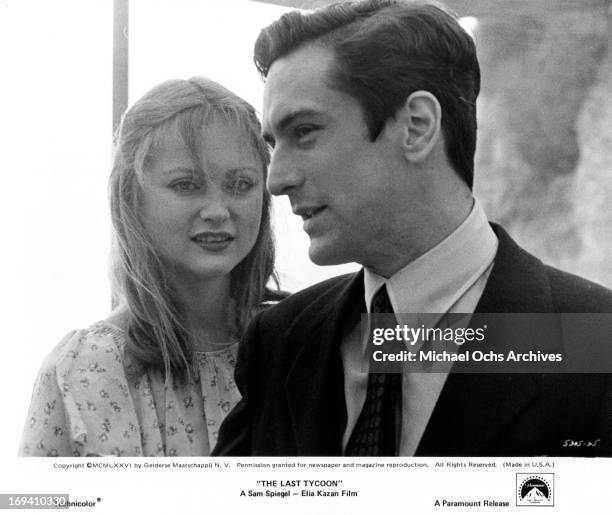 Ingrid Boulting standing behind Robert De Niro in a scene from the film 'The Last Tycoon', 1976.