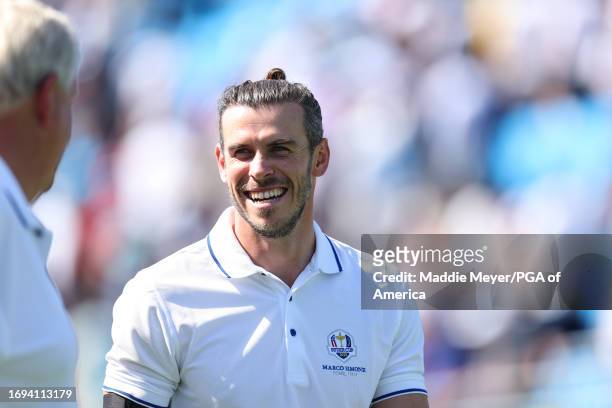 Gareth Bale smiles at Colin Montgomerie at the All-Star Match during the Ryder Cup at Marco Simone Golf & Country Club on Wednesday, September 27,...
