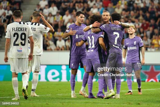 Mohamed Salah of Liverpool celebrates with teammates after scoring the team's third goal during the UEFA Europa League 2023/24 group stage match...