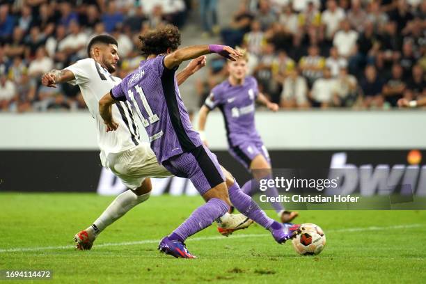 Mohamed Salah of Liverpool scores the team's third goal during the UEFA Europa League 2023/24 group stage match between LASK and Liverpool FC on...