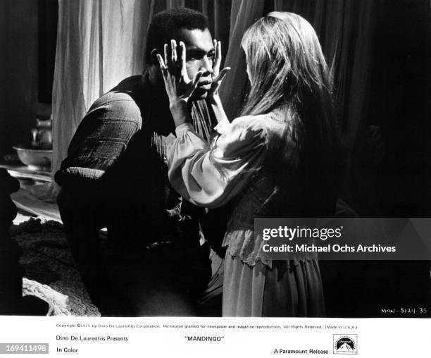 Ken Norton is seduced by Susan George in a scene from the film 'Mandingo', 1975.