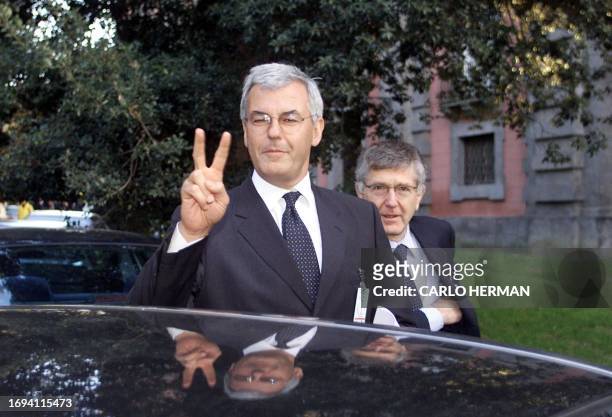 General executive manager of Italian bank Unicredito Alessandro Profumo gestures in front of the chairman of Banca Intesa, Giovanni Bazoli 15 January...