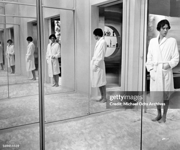 Pierre Clementi in bathrobe at the home of one of his wealthy patronesses in a scene from the film 'Listen, Let's Make Love', 1968.