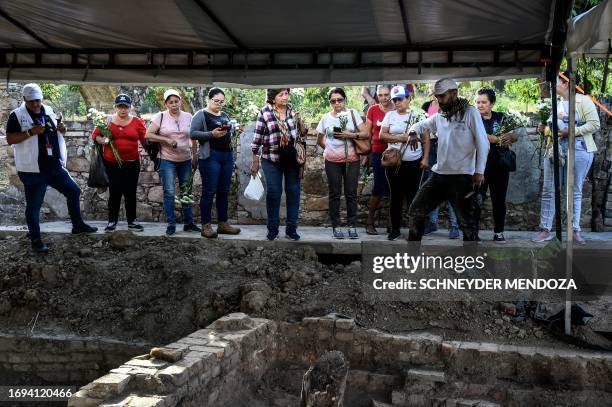 Relatives of disappeared victmits wait in front of the cremation chambers where paramilitary groups disappeared their victims during the armed...