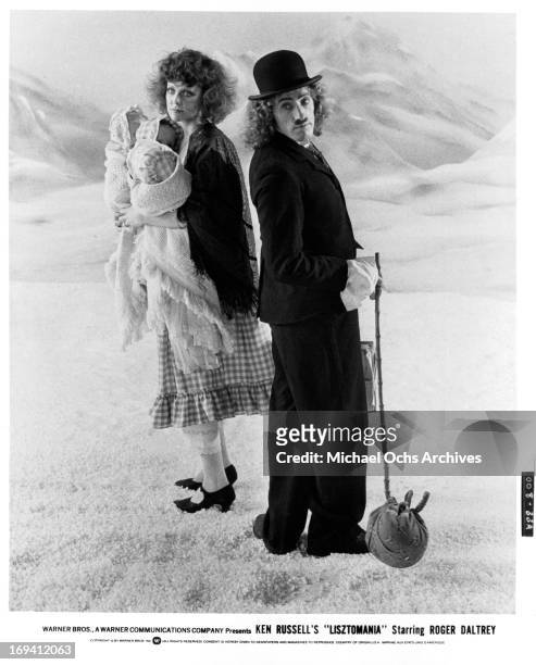 Fiona Lewis and Roger Daltrey dressed as vagabonds in a scene from the film 'Lisztomania', 1975.