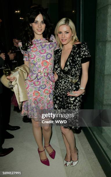 Zooey Deschanel and Elisha Cuthbert attend Gucci's charity runway show at the Chow residence.