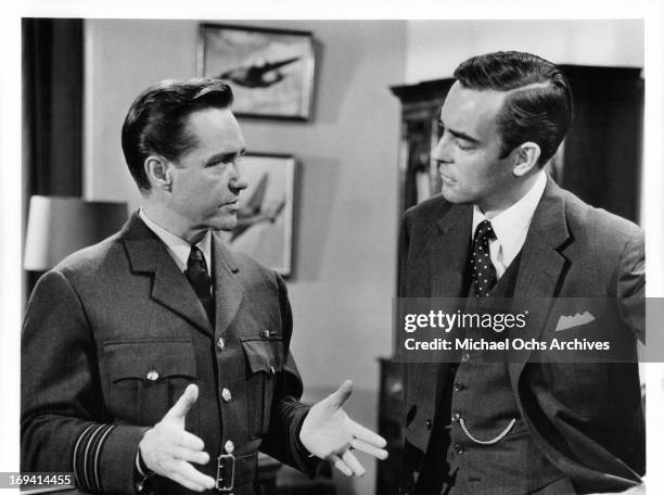 Richard Todd talks to Richard Johnson in a scene from the film 'Operation Crossbow', 1965.