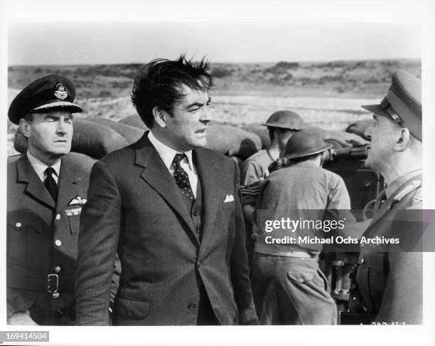 Richard Johnson talks to a general in a scene from the film 'Operation Crossbow', 1965.