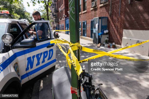 Police and crime scene investigators work at a Bronx day care center, after a 1-year-old child died and three other children were injured from...
