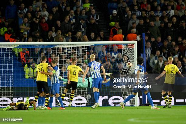 Djibril Sidibe of AEK Athens scores the team's first goal during the UEFA Europa League 2023/24 group stage match between Brighton & Hove Albion and...