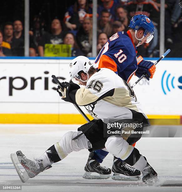 Keith Aucoin of the New York Islanders and Joe Vitale of the Pittsburgh Penguins battle for the puck in Game Six of the Eastern Conference...