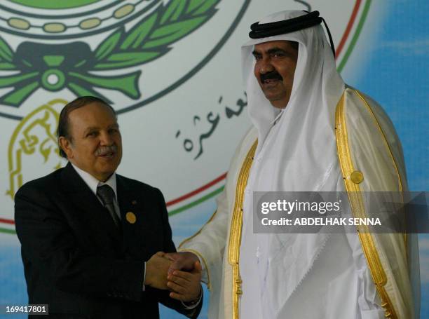 Algerian President Abdelaziz Bouteflika receives Qatar's Emir Sheikh Hamad bin Khalifa al-Thani prior to the opening session of the 17th Arab Summit...