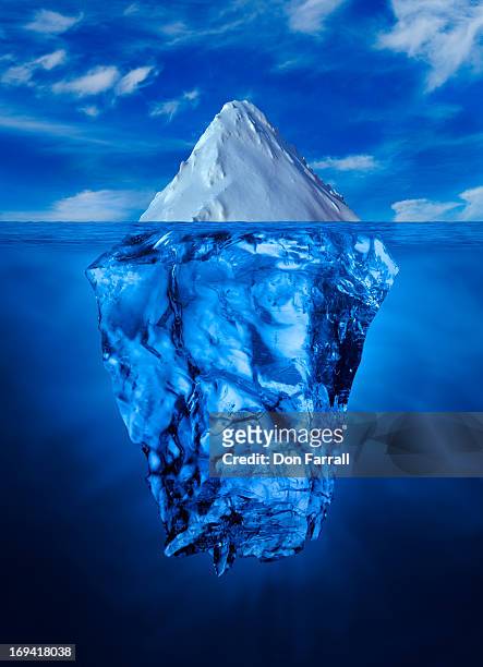ice burg, above and below water line - iceberg stock-fotos und bilder
