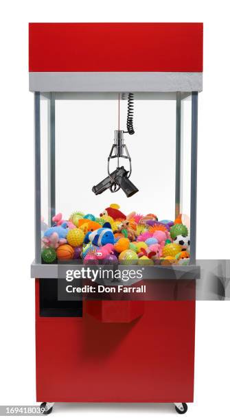 claw machine with gun - claw machine bildbanksfoton och bilder