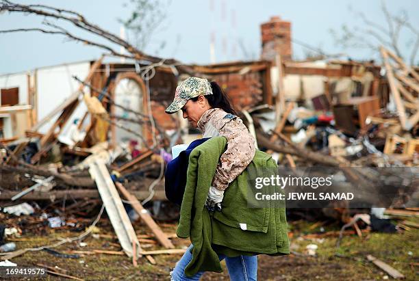 Volunteer brings blankets and other relief goods for a tornado victim in Moore, Oklahoma, on May 24, 2013. The tornado, one of the most powerful in...