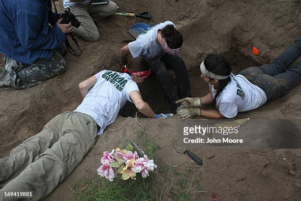 Forensic anthropology team unearths the remains of suspected undocumented immigrants from a gravesite on May 24, 2013 near Falfurrias, Brooks County,...