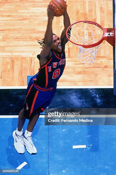Latrell Sprewell of the New York Knicks dunks against the Orlando Magic circa 1999 at the Orlando Arena in Orlando, Florida. NOTE TO USER: User...