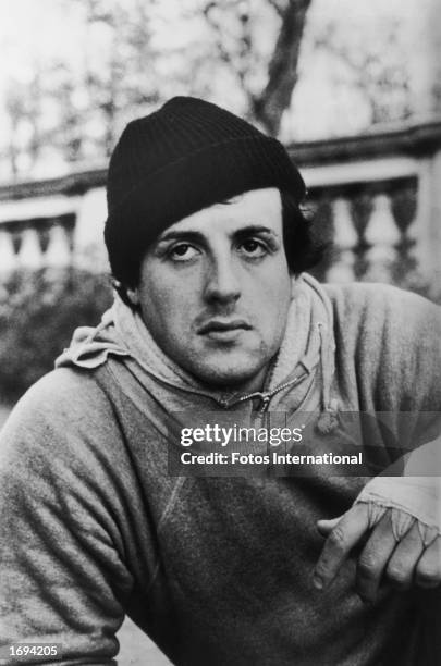 American actor Sylvester Stallone wears a knit hat, sweatshirts and bandages around his fists in a still from the film, 'Rocky,' directed by John G....