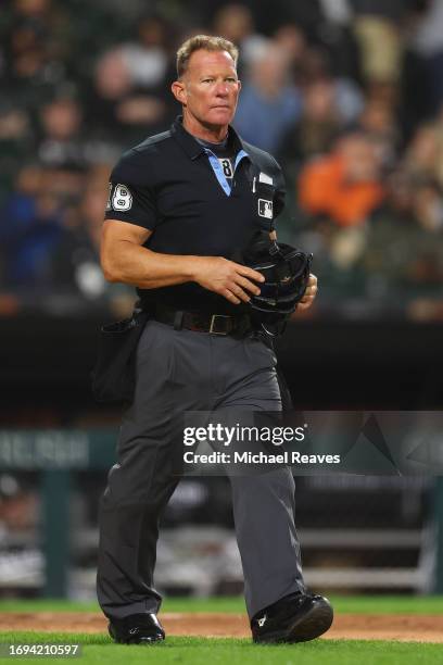 Umpire Jim Wolf looks on between the Chicago White Sox and the Minnesota Twins at Guaranteed Rate Field on September 14, 2023 in Chicago, Illinois.