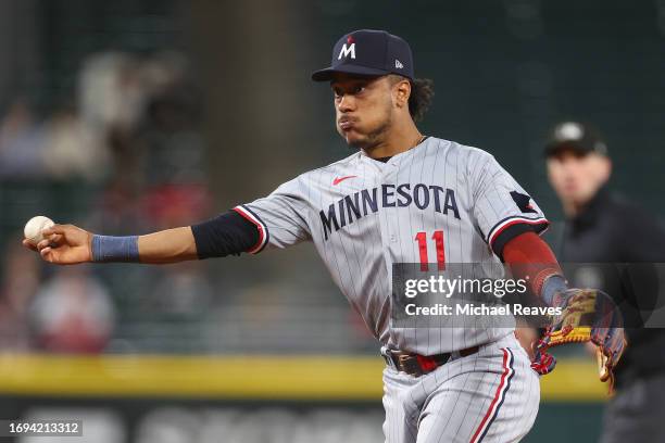 Jorge Polanco of the Minnesota Twins throws out a runner at first base against the Chicago White Sox at Guaranteed Rate Field on September 14, 2023...